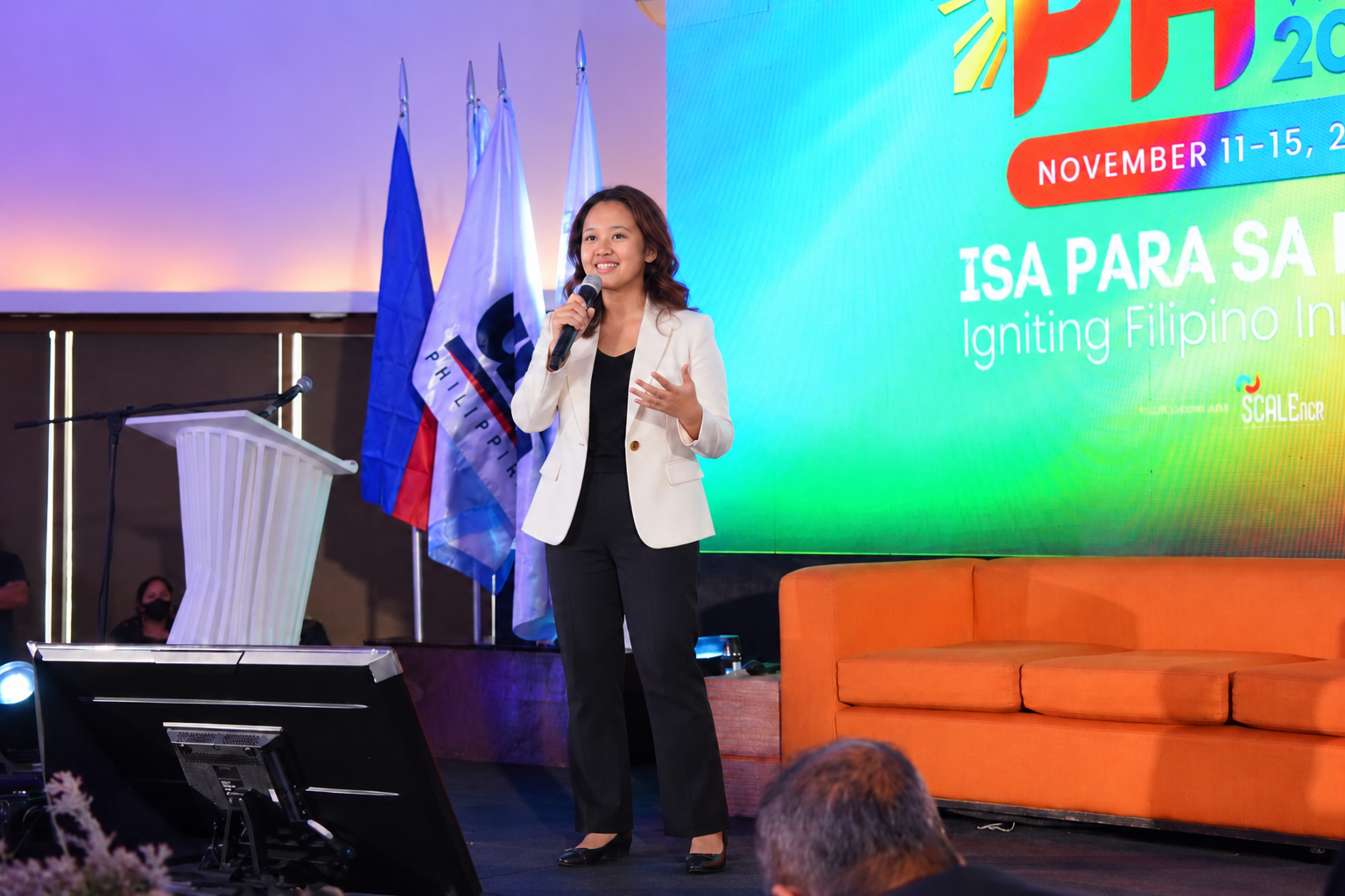 Speaking concept: Rheanne presenting on stage